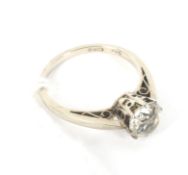 A white metal solitaire ring. Marked '9ct Cairo', set with a single colourless stone, size J/K, 1.