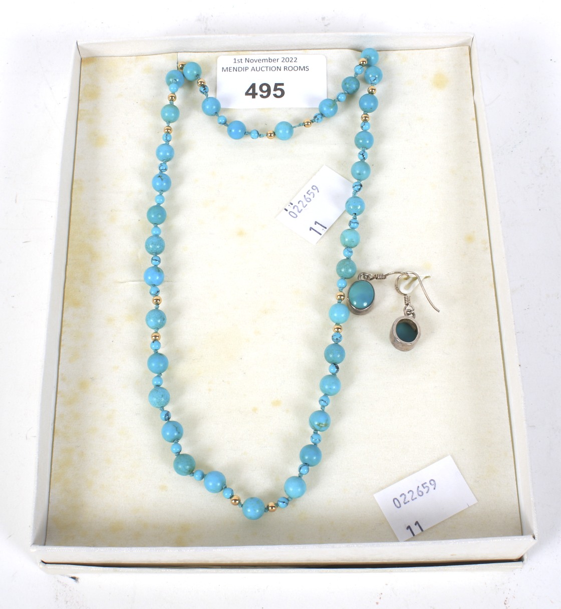 A contemporary necklace, earrings and bracelet set.