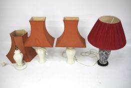 Four table lamps and shades.