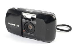 An Olympus MJU I 35mm point and shoot camera. With a 35mm 1:3.