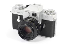 A silver Leica Leicaflex 35mm SLR camera. With a 50mm 1:2 Summicron-R lens.