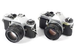 Two Pentax 35mm SLR cameras.