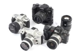 Four Minolta 35mm SLR camera bodies together with five lenses.