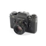A black Leica Leicaflex SL2 35mm SLR camera. With 50mm 1:2 Summicron R lens.