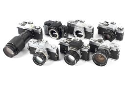 Seven Minolta 35mm SLR cameras. To include an SR-7 with a 28mm 1:3.