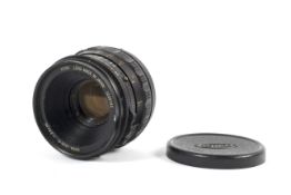 A Kowa medium format 85mm 1:2.8 black camera lens.