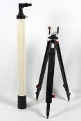 A telescope together with a tripod.