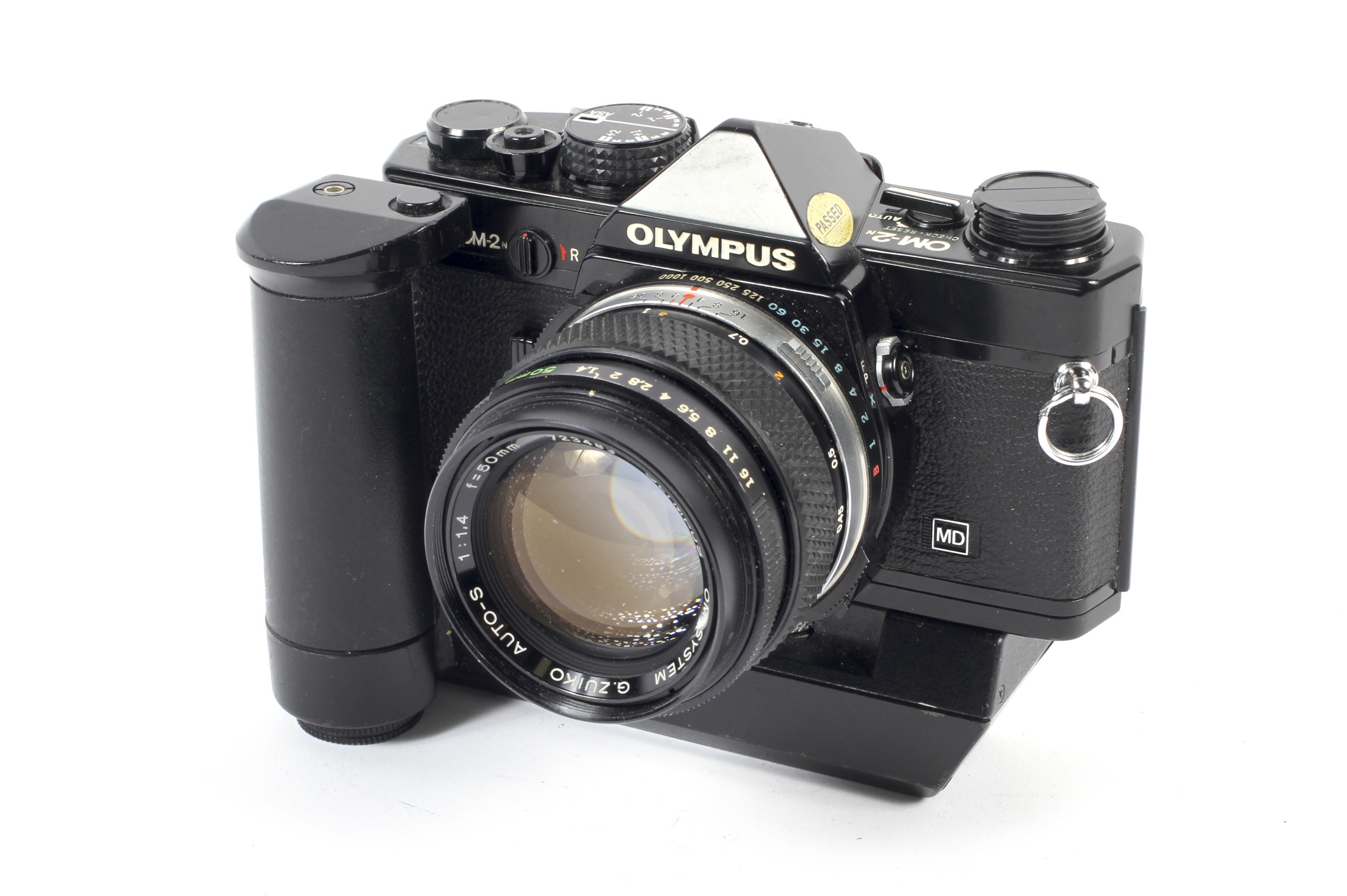 An Olympus OM-2N 35mm SLR camera. Black, with a 50mm 1:1.4 G.