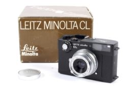 A black Leitz Minolta CL 35mm rangefinder camera. With a Leica 35mm 1:3.5 Summaron lens.