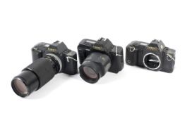 Three Canon 35mm SLR cameras. To include a T70 body, a T70 with a 80-200mm 1:4.