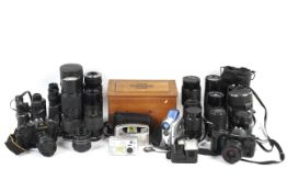 A collection of cameras, lenses, binocular and accessories.