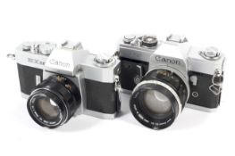 Two Canon 35mm SLR cameras. To include an FT with a 50mm 1:1.4 lens and an EXee with a 50mm 1:1.