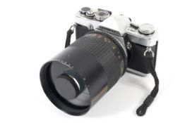 An Olympus OM-1 35mm SLR camera.