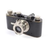 A Leica I 35mm rangefinder camera, 1930, black. Serial no 27033, with a Leitz Elmar 50mm 1:3.