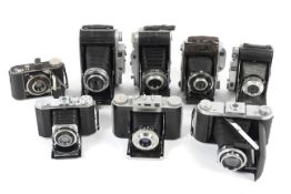 Nine folding cameras.
