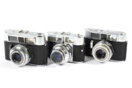 Three Voigtlander Vito 35mm rangefinder cameras.