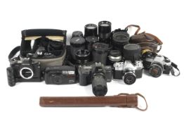 A collection of cameras, lenses and related items.
