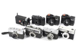 Eight compact and half frame cameras.