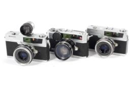 Three Petri 35mm rangefinder cameras. To include two 7s each with 45mm 1:2.8 lenses and an E.