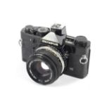 An Olympus OM-1N 35mm SLR camera. Black, with a 50mm 1:1.