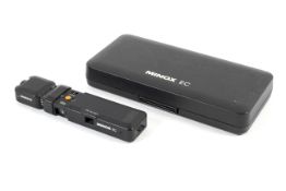 A Minox EC sub-miniature spy camera and a Minox Magicube flash attachment