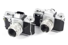 Two Wirgin Edixa Flex 35mm SLR cameras. Each with a 50mm 1:2.8 Cassarit lens.