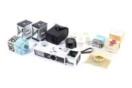 A Rollei 16 sub-miniature camera and accessories.