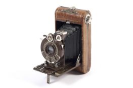 A Vest Pocket Kodak Series III 127 folding camera. Brown, with an 83mm 1:6.