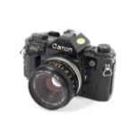 A Canon A1 35mm SLR camera with a 50mm 1:1.8 lens.