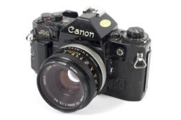 A Canon A1 35mm SLR camera with a 50mm 1:1.8 lens.