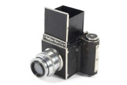 A Reflex Korelle 6x6 medium format SLR camera. With a 6'' 1:5.