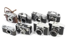Eight 35mm cameras. To include two Pentina Ms, one with a 50mm 1:2.