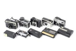 Nine Kodak pocket cameras.