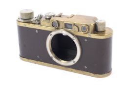 A Russian replica 35mm rangefinder camera body. Based on a Leica II, with 'Leica D.R.P.