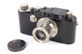 A Leica III 35mm rangefinder camera, black, 1935. With a 50mm 1:3.5 Leitz Elmar lens.