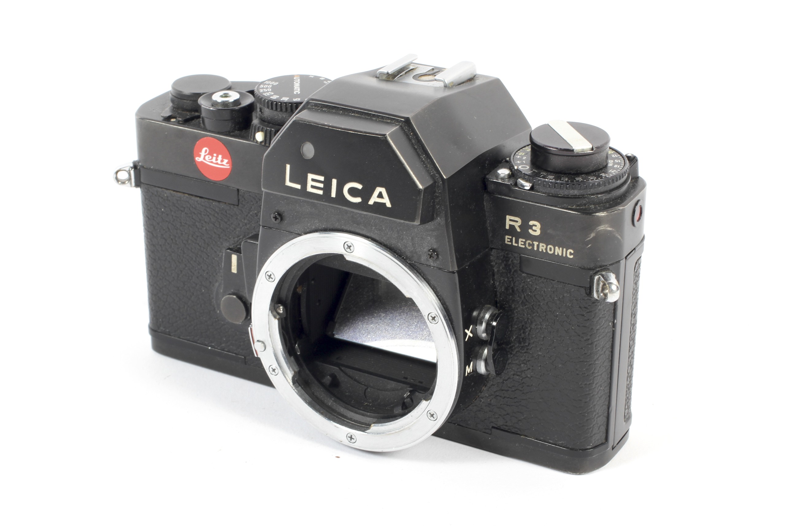 A black Leica R3 electronic 35mm SLR camera body.