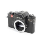 A black Leica R3 electronic 35mm SLR camera body.