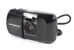 An Olympus Stylus 35mm point and shoot camera. With a 35mm 1:3.