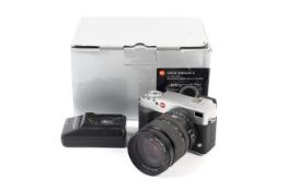 A Leica Digilux 3 DSLR camera. With a 14-50mm 1:2.8 lens.