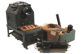 An industrial magic lantern projector, an enlarger, and slides.