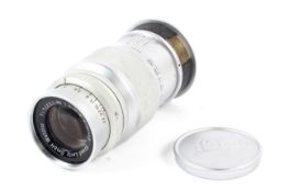 A Leitz Leica 90mm 1:4 elmar camera lens. Chrome, M39 screw mount.
