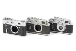 Three 35mm rangefinder cameras. To include a Zorki 4K with a 50mm 1:3.