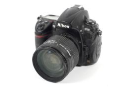 A Nikon D700 DSLR camera. With a Nikkor 24-120mm 1:3.5-5.