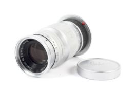 A Leitz Leica 90mm 1:4 elmar camera lens. Chrome M mount.