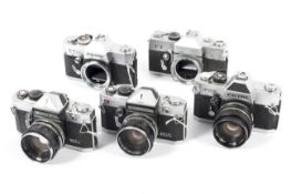Five Petri 35mm SLR cameras.
