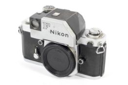 A silver Nikon F2 35mm SLR camera body with a Photomic prism finder.