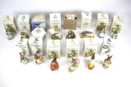 A collection of Beatrix Potter figures.