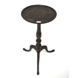 A mahogany wine table of circular form. Raised on tripod support, (repairs to galleried top).