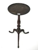 A mahogany wine table of circular form. Raised on tripod support, (repairs to galleried top).