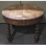 A 20th century oak wind out table.
